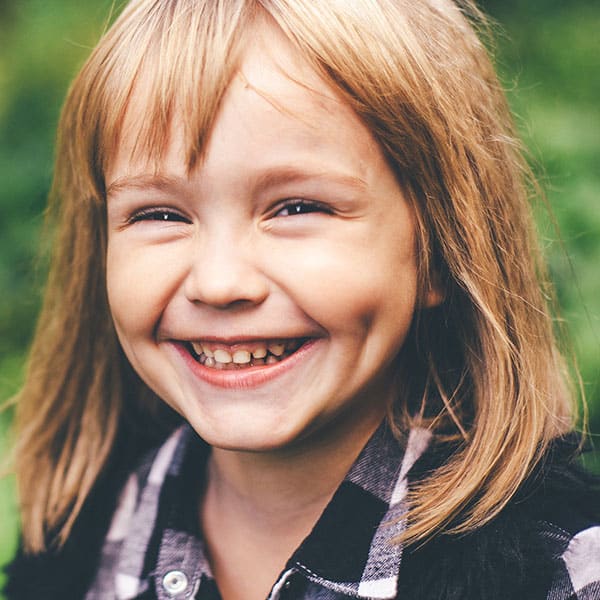 YoungGirlSmilingOutdoors Young Girl Smiling Outdoors