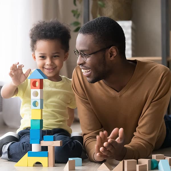 ChildandFatherPlayingWithBlocks Child and father playing with blocks