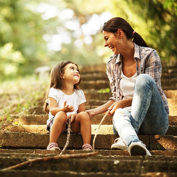 MotherandDaughterOnStairs Mother and Daughter sitting on stairs outside